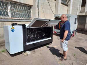 Man looking at a power generator